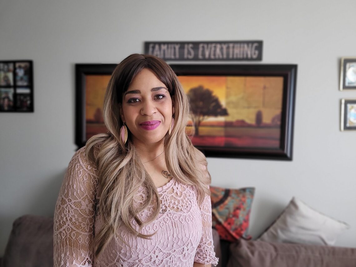 Christina smiling in her home