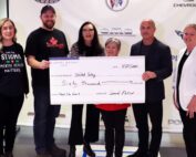 United Way Niagara staff joined by General Motors staff at a cheque presentation