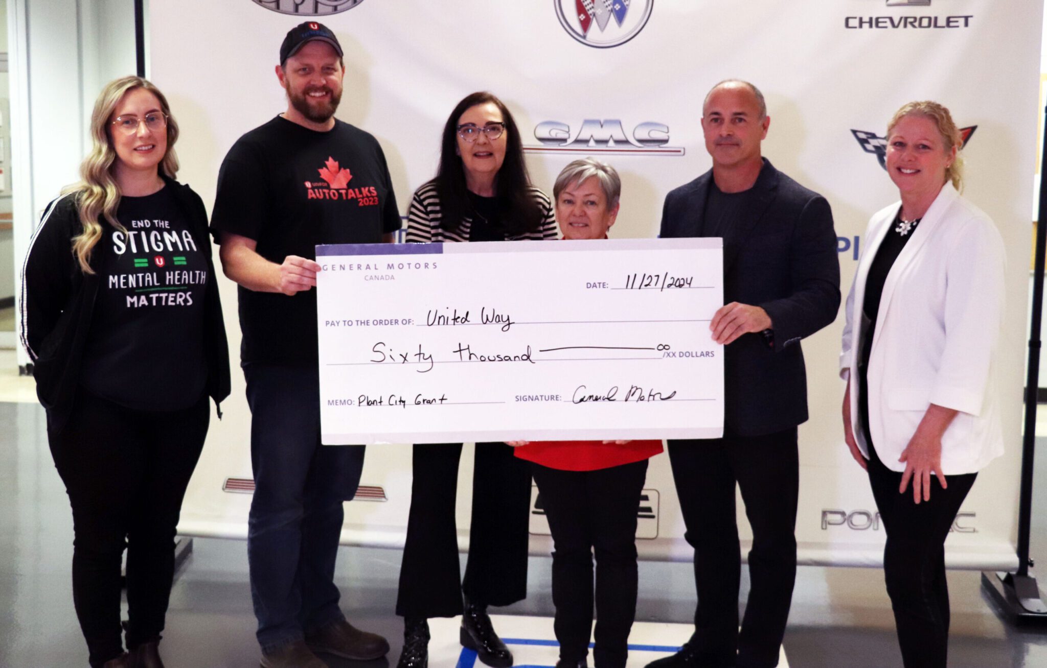 United Way Niagara staff joined by General Motors staff at a cheque presentation